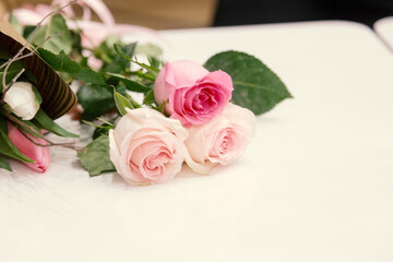 Delicate pink roses as background. Retro filter. Soft color. Bouquet of flowers for the design of postcards, invitations, congratulations on the holiday, birthday