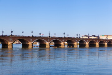 Pont de pierre (Stone Bridge) on a bright sunny day, Bordeaux, France