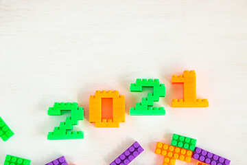 2021 bright numbers from the children's designer. Happy new year greeting card, copy space for text.