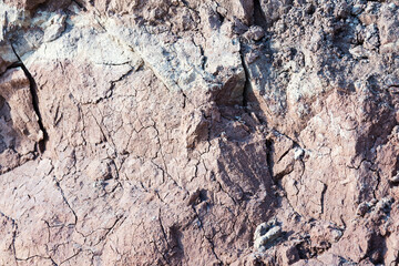 Background of mountain landslide in an environmentally hazardous area. Large cracks in the ground, the descent of soil layers, coquina. Deadly risk of coastal collapse