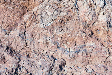 Background of mountain landslide in an environmentally hazardous area. Large cracks in the ground, the descent of soil layers, coquina. Deadly risk of coastal collapse