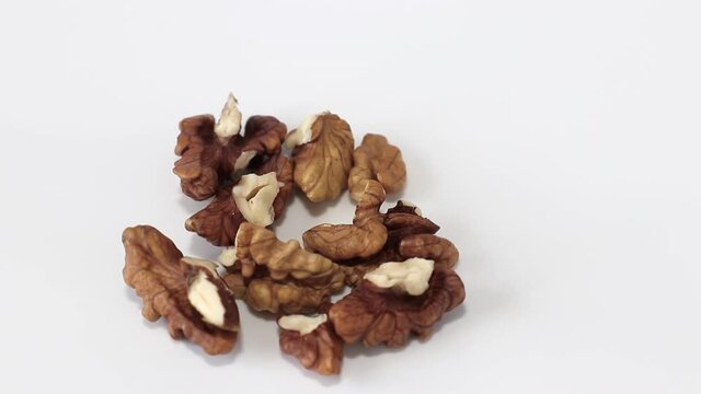 walnuts kernel rotating on white background close-up. concept of vegetarian food