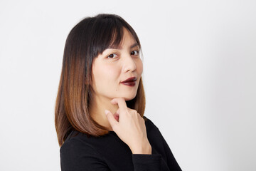 Fototapeta premium Asian Woman in black dress on white