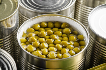 Canned green peas in just opened tin can. Non-perishable food