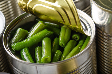 Canned green beans in just opened tin can. Non-perishable food