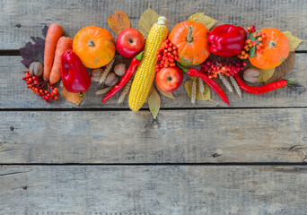 Autumn background set, fallen leaves, fruits, vegetables, wooden table. Seasonal horizontal set, aged vintage linen napkin, copy space. Thanksgiving food, healthy and fresh, top view, flat lay.