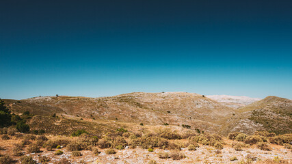 Fototapeta na wymiar Andalusia, Spain. View Of Mountains Landscape in Summer Sunny Day With Clear Blue Sky.