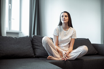 Young woman pretty relaxing on couch in living room