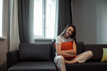 Obraz premium Young woman pretty relaxing on couch in living room