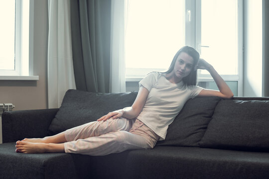 Young Woman Pretty Relaxing On Couch In Living Room