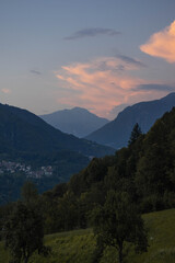 This picture was taken during my first night in the quiet mountains of the Lombard, Italy. It captures the sun going down and the calm vibe with it.