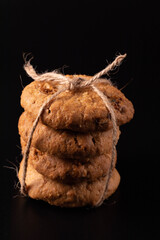 Cookies stacked on a black background.