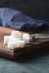 sugar cubes closeup on a dark background backlit 