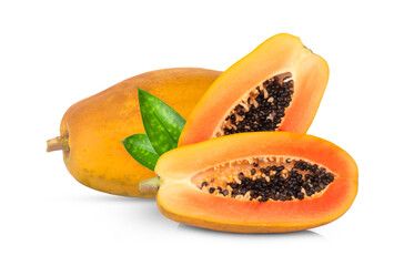 whole and half ripe papaya fruit with green leaves isolated on white background
