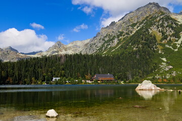 Mountain lake with solitary rocks in the foreground 