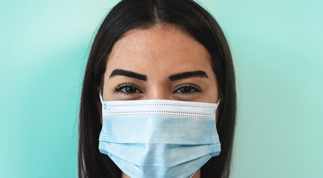 Young woman wearing face surgical mask - Young girl using facemask for preventing and stop corona virus spread - People health care concept