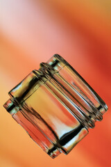 neck of a wine bottle on a reddish background