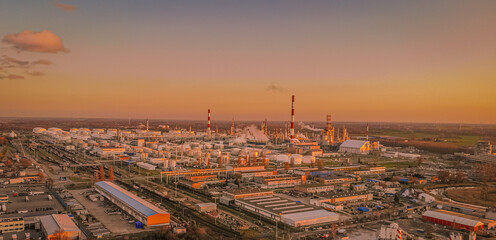 sunset over the oil refinery 