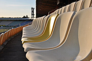 Stadium seat with one different Color,Tribune in Hockenheim , Side view, one new yellow Seat, old...