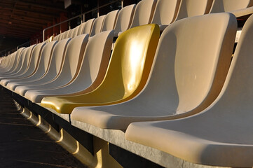 Tribune seat with one different Color,Tribune in Hockenheim , Side view, one new yellow Seat, old...