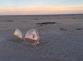 Sunglasses and a beach sunset