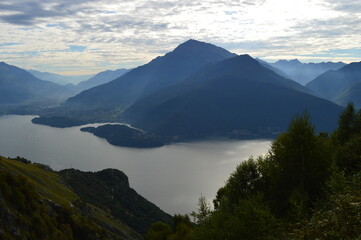 Reflections of the mountains around Lake Como in Lombardy, Northern Italy