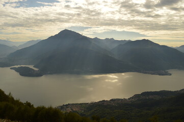 Reflections of the mountains around Lake Como in Lombardy, Northern Italy