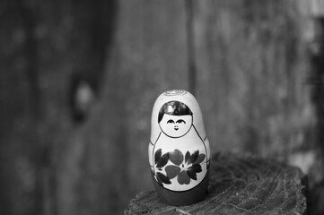 Matryoshka on a wooden background. Background image.