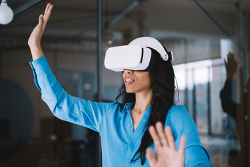 Excited female using modern VR glasses