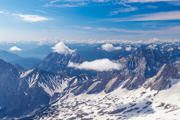 Panoramic view of the European Alps from the top of Zugspitze on a sunny summer day