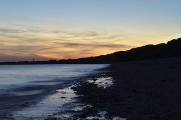 Fototapeta na wymiar Sunset at the beach silhouette