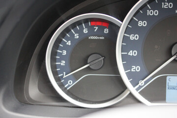 car dashboard with tachometer