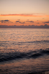 Fototapeta na wymiar sunset at sea small waves
