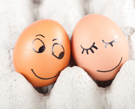 two funny smiling eggs in a packet