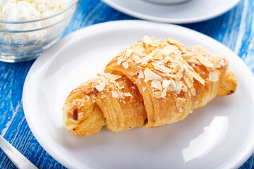 Pastry breakfast with croissant and cottage cheese