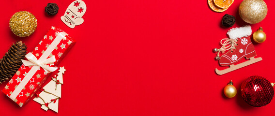 Top view of Banner Christmas decorations on red background. New Year holiday concept with copy space