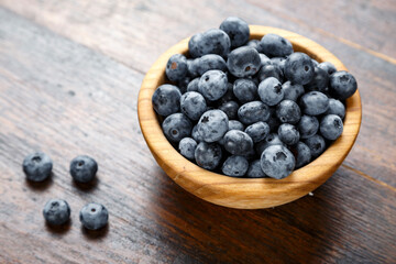 Blueberries and strawberries are prepared for breakfast.