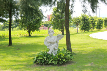 statue of a person in garden