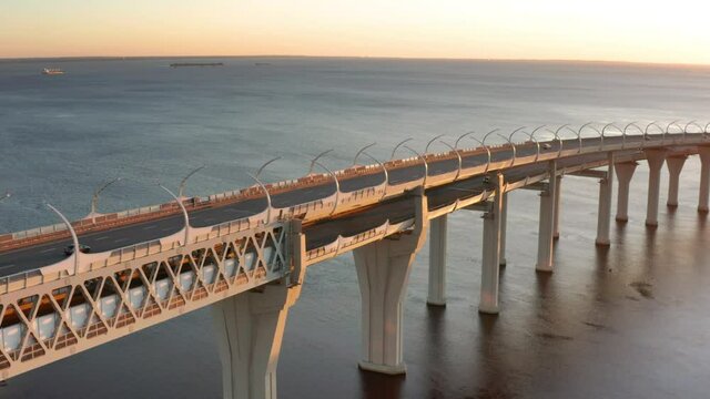 High-speed toll road, highway bypassing the city center St. Petersburg, the central section of the western high-speed section. A beautiful view of the sunset over the Gulf of Finland.