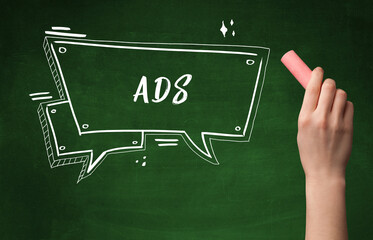 Hand drawing ADS abbreviation with white chalk on blackboard