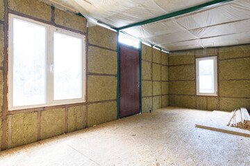 Fragment of the wall of the interior of a country house, the wall is thermally insulated with mineral plates
