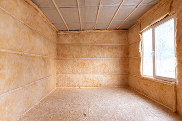 Roll insulation on the inner walls of a small room