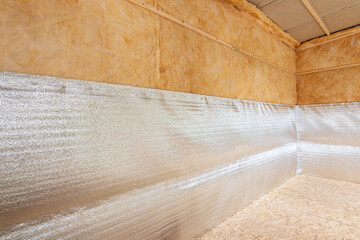Thermal insulation of a country house from reflective foamed polyethylene laminated with lavsan for house insulation