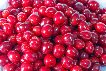 Red cherries close up background texture