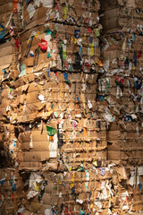 Dramatic pile of cardboard bales for recycling proccess