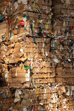 Dramatic pile of cardboard bales for recycling proccess
