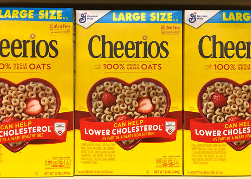 Alameda, CA - Aug 20, 2020: Grocery store shelf with General Mills brand Cheerios cereal boxes. Large size.
