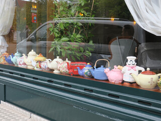 collection of teapots in the window of a hotel in Amsterdam