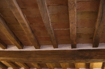 ceiling in exposed wooden beams and terracotta