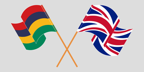 Crossed and waving flags of Mauritius and the UK